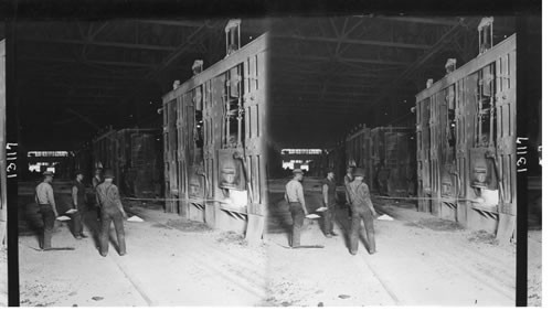 Open Hearth Furnaces - Workman making bottom. Homestead Steel Works. Penna