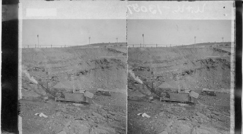 Steam shovel loading cars and view of coal strata. Anthracite stripping. Penna