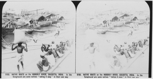 Inscribed in recto: 9185. NATIVE BOATS on the HOOGHLY RIVER, CALCUTTA, INDIA. In the foreground are some natives “taking it easy” in their own way