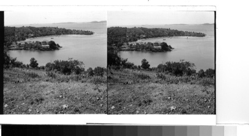 Island of St. John: View of Cruz Bay and the little town. The fort-like building on the peninsula is the government house for that island