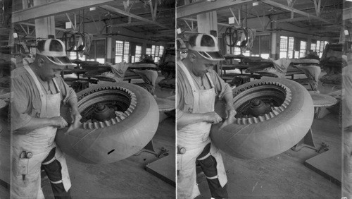 Putting on band on hand built truck tire, 38x9. Akron, Ohio