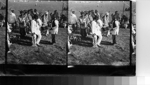 A miscellaneous group of dancers with Tom Tom at the right. Fort Belknap Reservation, Mont., July 1906