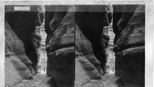 Narrow gateway to Petra and Isis temple - seen through crevice in cliffs, Palestine