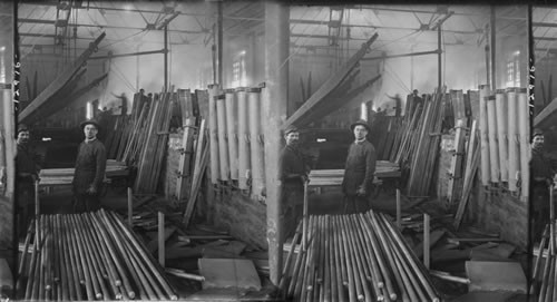 Small Bullets in Steel Mill. Foundry room of brass works - showing rods and bars just cast, Bridgeport, Conn