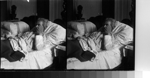 Mark Twain in his favorite position for work