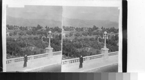 Pasadena's homes and gardens, massive ridge at Mt. Lowe in rear, California