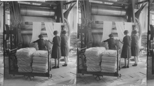 Linen Calendar Machine doing final smoothing process. Small roller in centre is steam headed. Guelph. Canada