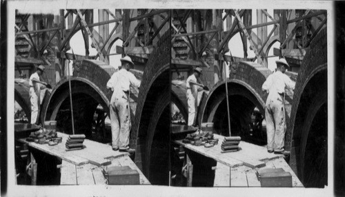 Workmen Setting Small Stones in Place in Arches of Nave