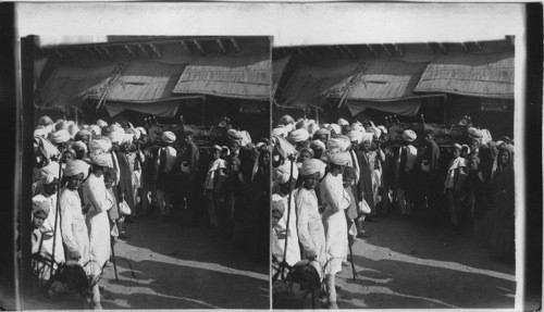 Hindu funeral procession, bystanders and quaint Native Shops, Agra (E.) India