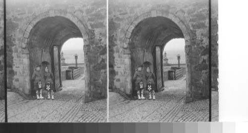 Guards before gate of Stirling Castle - Robert Bruce monument seen through gate