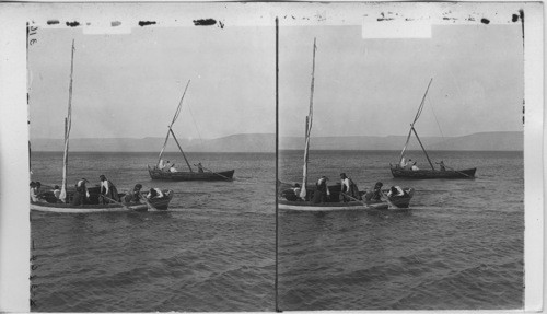 Fisherman on the Sea of Galilee and distant hills of the Gadarenes. Palestine