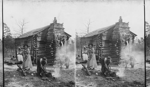 Busy Negro Family Beside Log Cabin. N.C