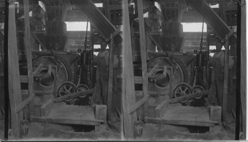 Mixing lime sand for brick making at the sand bank. Ontario, Prince Edward County