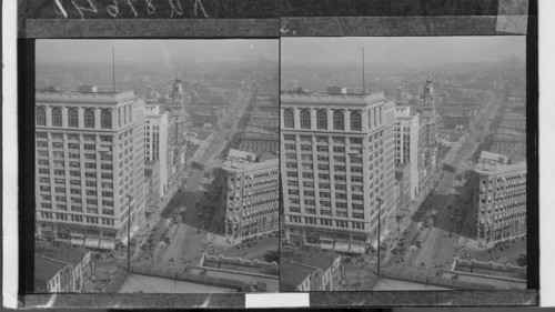 [Views] Looking East from Meridan St. along Washington St., the main Street of the City. Indianapolis, Ind. (The large building in the foreground is the I.O.O.F. Building, and the one beyond with the clock tower, is the Marion County Court House. 1928 William E. Meyer, Indianapolis.)