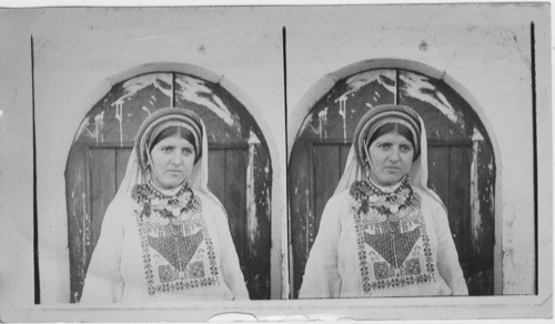 A Girl of Ramallah wearing national Costumes and Ornaments