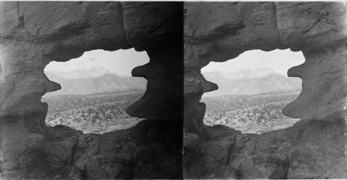 Pike's Peak from cave, In the Garden of the Gods, Colo