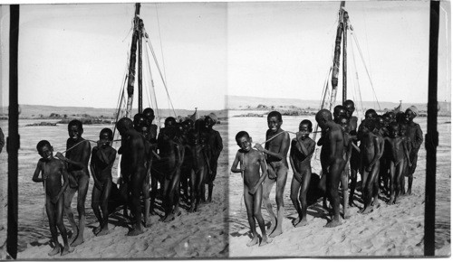 Ethiopian boys pulling a sail-boat up the First Cataract, Egypt