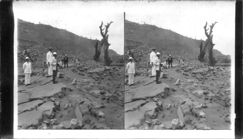 Scientists and naval officers exploring the ruins of St. Pierre covered with volcanic ashes