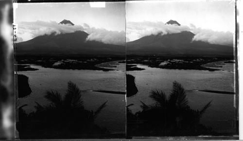 Mayon, the beautiful volcano of Southern Luzon, when evening shadow shrouds its bake and its summit glows in lovely sunset radiance
