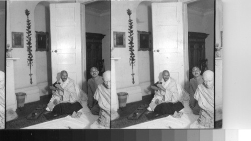 "The Universal Appeal of the stereograph - Mahatma Gandhi, Mystic and Teacher Receives Keystone photographer at his London office."