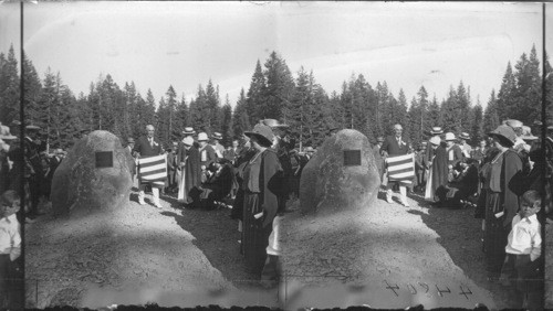 Pres. Harding folding flag after unveiling monument Mrs. Kennedy on right. Oregon
