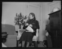 Evangeline Booth, in her Salvationist uniform, sits next to unidentified man, Los Angeles, 1935