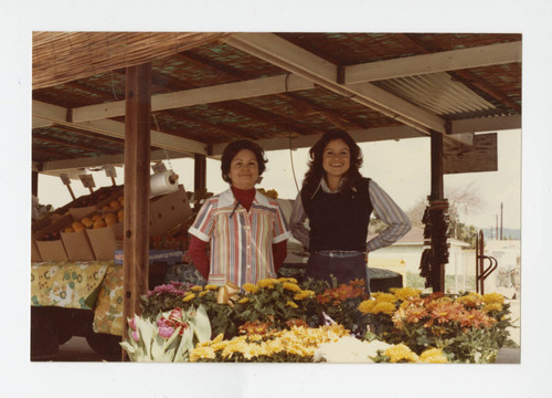 Dolores Gallegos and Christine Amira in front of G&G Produce stand, Los Nietos, California