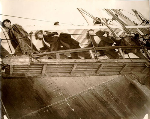 [Group of unidentified men boarding a ship]