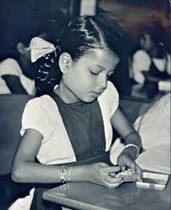 School girl from Aden in Southern Yemen. Matches are used to teach math. 1966