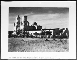 San Xavier Mission, showing line of trees in foreground, Tucson, Arizona