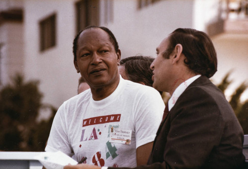 Los Angeles Mayor Tom Bradley (left) and Santa Monica Mayor Ken Edwards (right) at Olympic torch relay on July 21, 1984, Santa Monica, Calif
