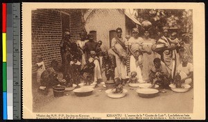 Women bathing infants outdoors, Kisantu, Congo, ca.1920-1940