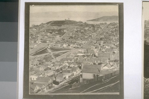 Northeast from top of Russian Hill. Washington Square, center; Telegraph Hill and semaphore station (hill with house on top), distance; Filbert St.; Union St.; Goat Island, distance