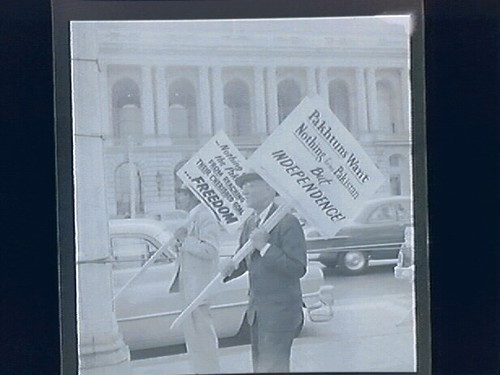 1.) newspaper stand (headline "Japan Treaty...Today Gremyko Block Pact) 2.)Street Demonstrations Against Conference