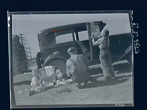 Untitled (Family Eating by Car)