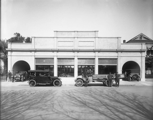 Men of Adams Commercial Trucks in front of Case garage