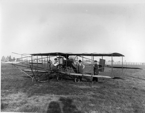 Biplane in field