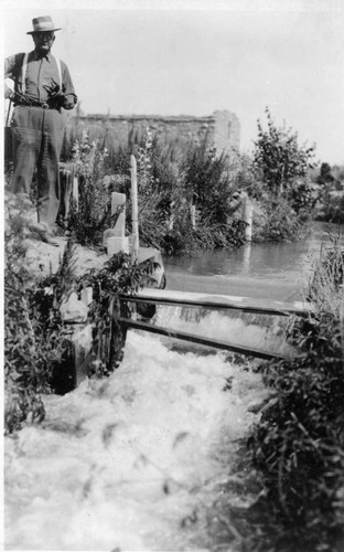 J C Forkner Standing By Irrigation Canal