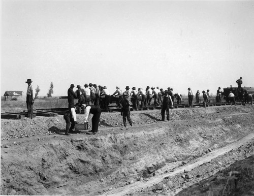 Group of Men Working on Railroad Tracks