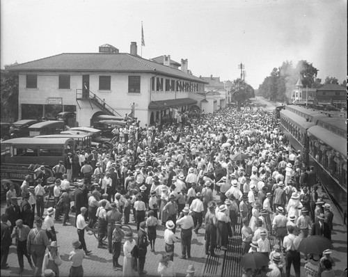 Crowd gathered to see of Machine Gun Unit at Fresno's Santa Fe Depot as the leave for War