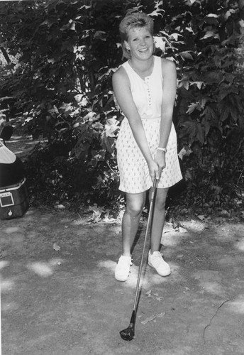 Woman holding a golf club