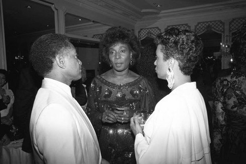 Madge Sinclair talking with others at the Black Emmy nominees dinner, Los Angeles, 1989
