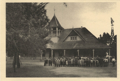 1920's postcard, student's in front of school