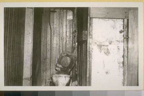 Toilet in rear of 136 E. 2nd St. Barber shop