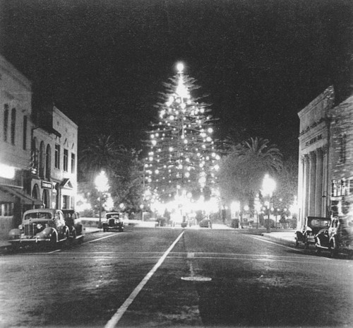 Plaza Square with night scene of Christmas tree, Orange, California, 1930