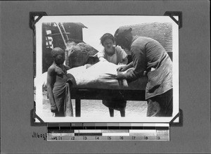 Missionaries Giersch and Waldner produce a grass mattress, Mbozi, Tanzania, ca.1906-1929