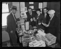 Sheriff Frederick P. Dickerson shows stolen goods to H. L. Sisley, Ray Greeley, Mrs. L.E. Armstrong, and George Morrison, Florence, 1935