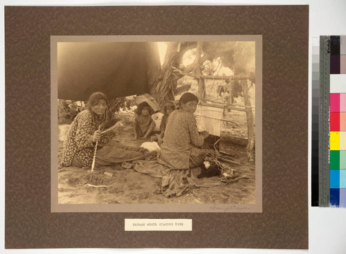 Jeddito Springs, Painted Desert. Navajo women spinning and weaving
