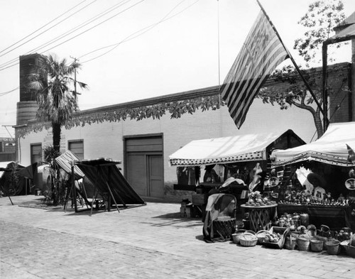 Vending booths and flag, Olvera Street