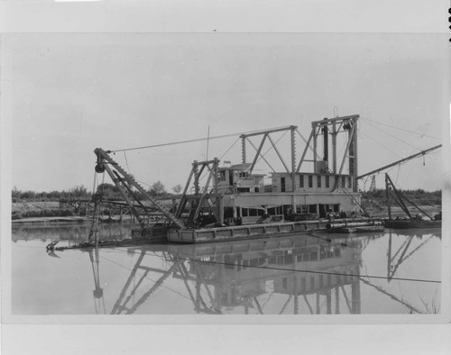 The "Brawley" was one of the Imperial Irrigation District's several electric dredgers, shown here in about 1920 removing silt from the main canal in Baja California